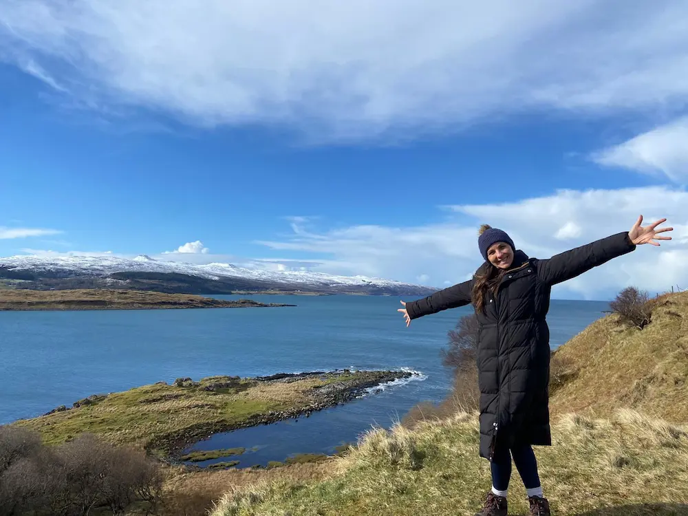 Dr Jess Morgan outdoors by a lake